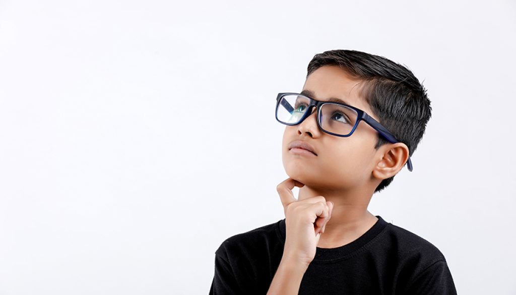 Cute little Indian / Asian boy wearing spectacles